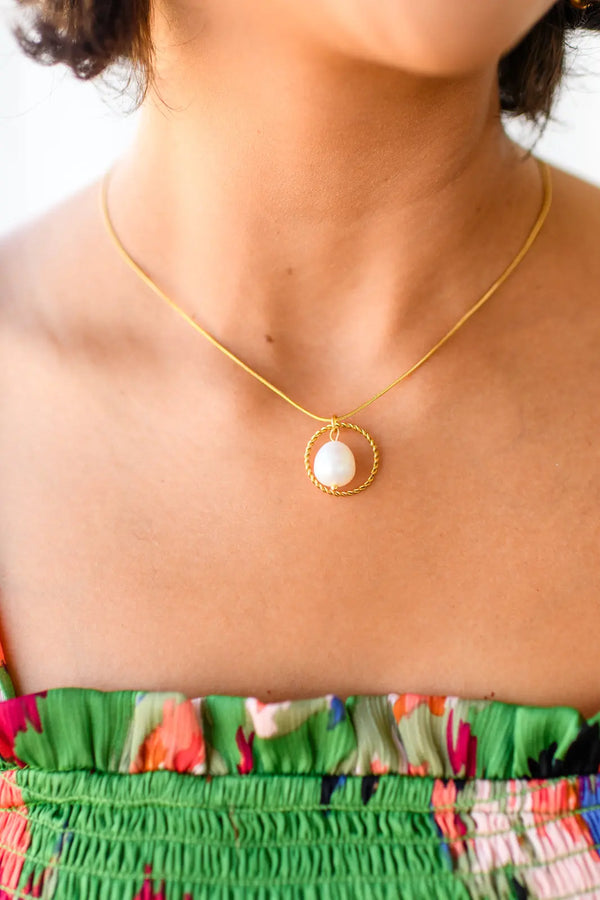 Close-up view of Elegant Gold Pearl Pendant Necklace showcasing the free-hanging pearl.